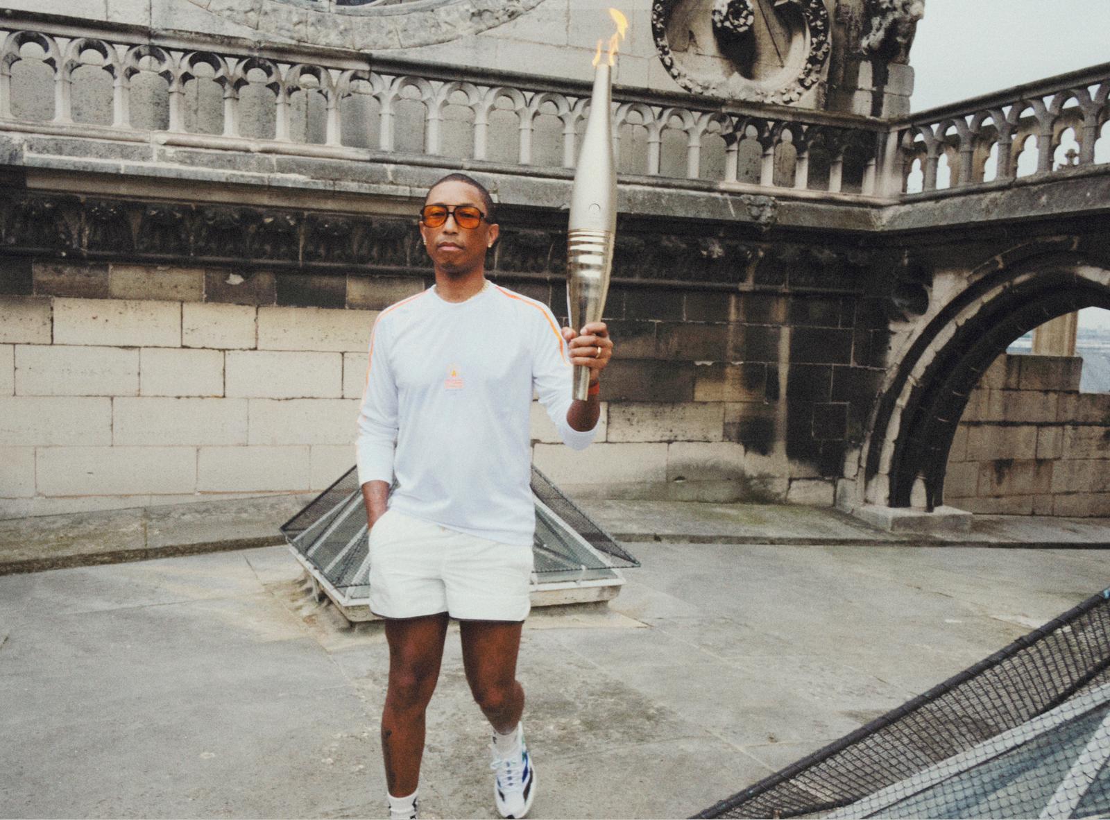 Image may contain Pharrell Williams Light Adult Person Clothing Footwear Shoe Accessories Glasses and Torch