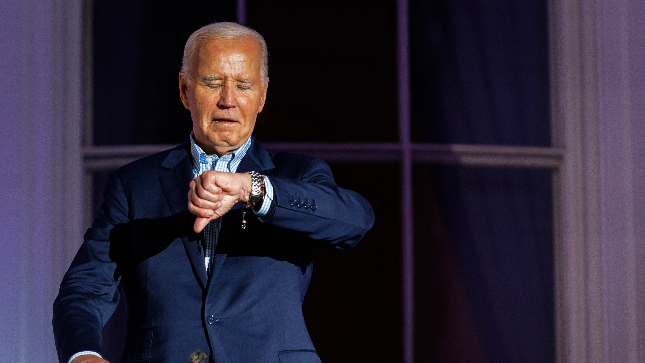 Image may contain Joe Biden Adult Person People Accessories Bracelet Jewelry Blazer Clothing Coat and Jacket