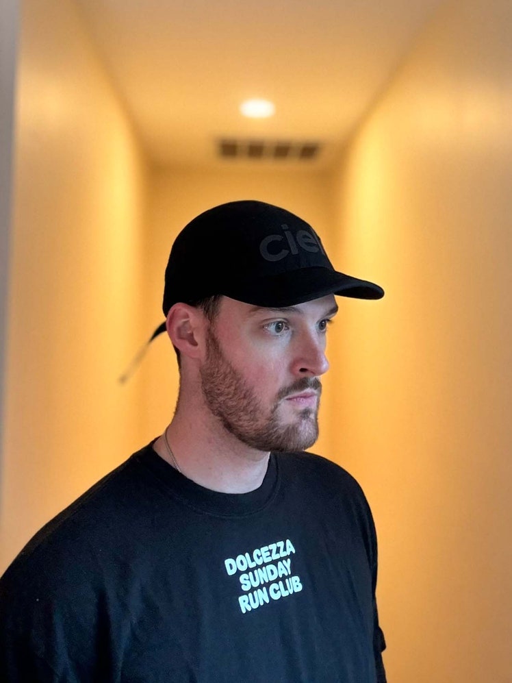 Image may contain: Adult, Person, Baseball Cap, Cap, Clothing, Hat, Head, and Face